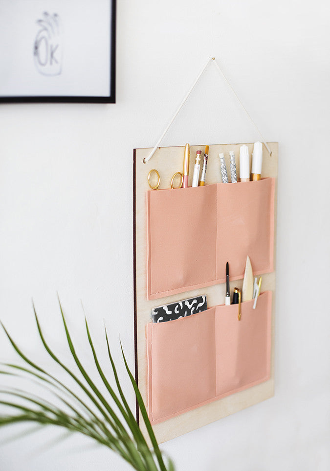 DIY Hanging Organizer by The Lovely Drawer