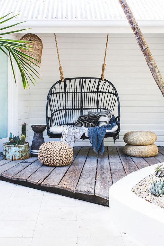 Boho Outdoor Space With Hanging Loveseat - Image via My Domaine 