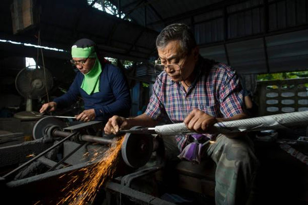 Blacksmiths in Thailand making swords