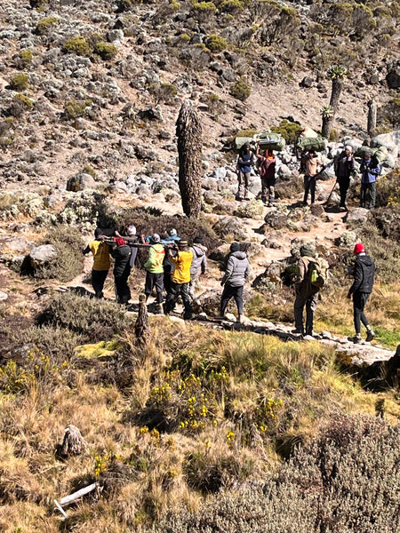 Porter being carried on a stretcher