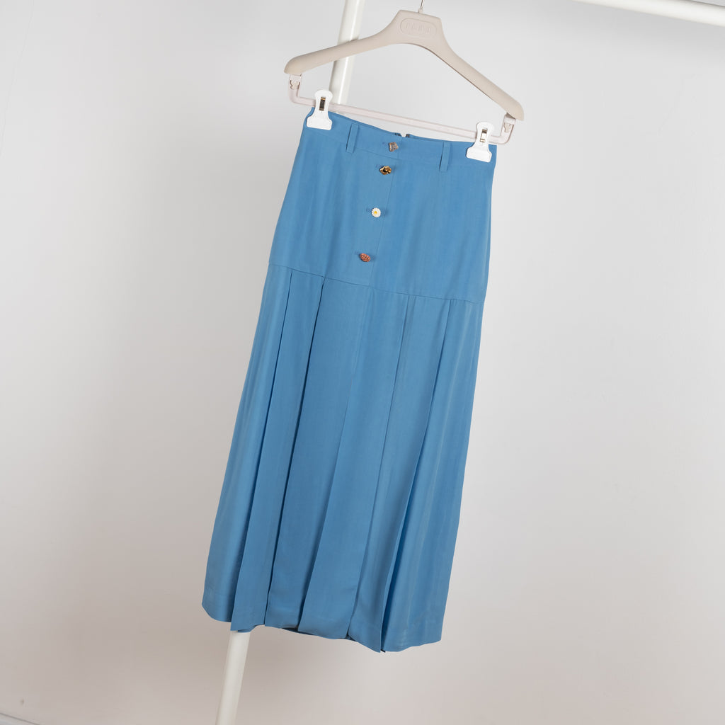 The Miller Skirt by Rejina Pyo is a high waisted pleated skirt with custom made buttons in a bright blue