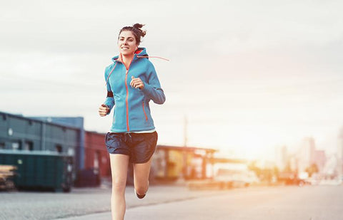 woman running down street