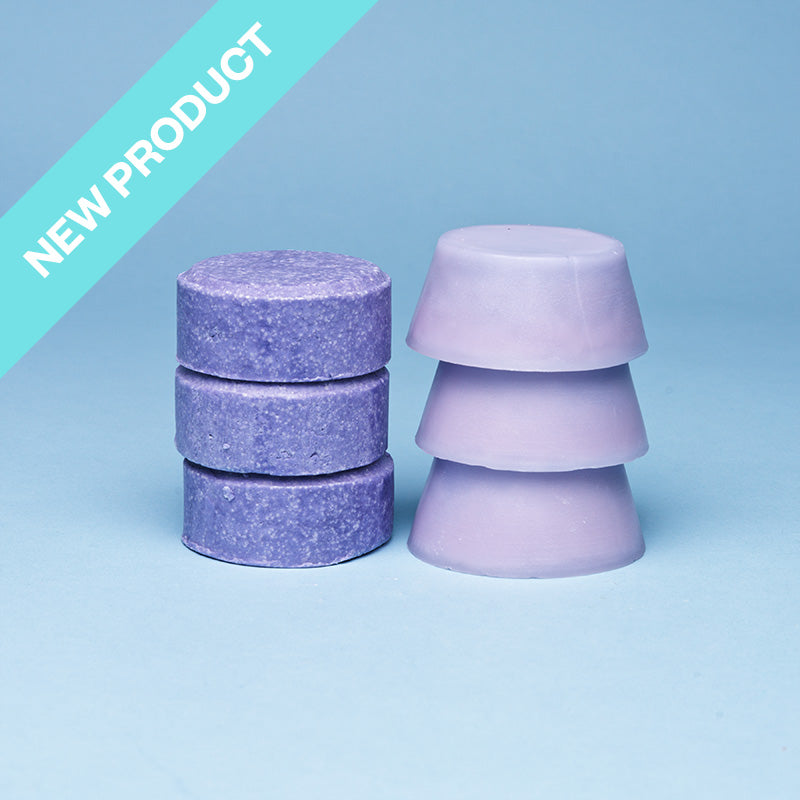 a purple round conditioner bar and shampoo bar