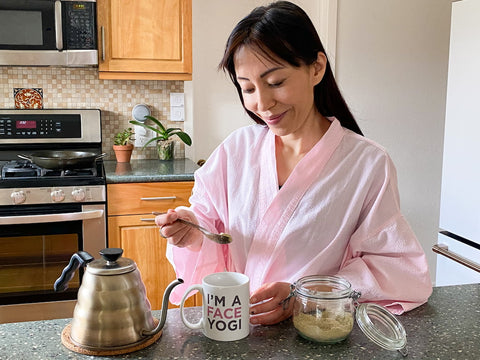 Woman in the kitchen preparing Collagen SuperPowder