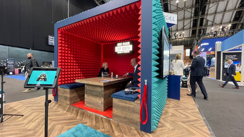 MAXIM-UK-acoustic foam installed on the ceiling of a booth at a conference