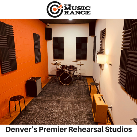 The music range in Denver CO - picture of music studio with drums - there are acoustic panels on the walls and bass traps in the upper corners