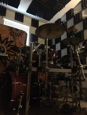 spot treatment with small 12x12" acoustic panels inside of a drum room