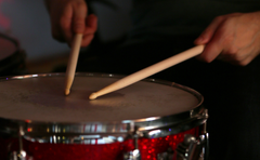 drum being struck by stick