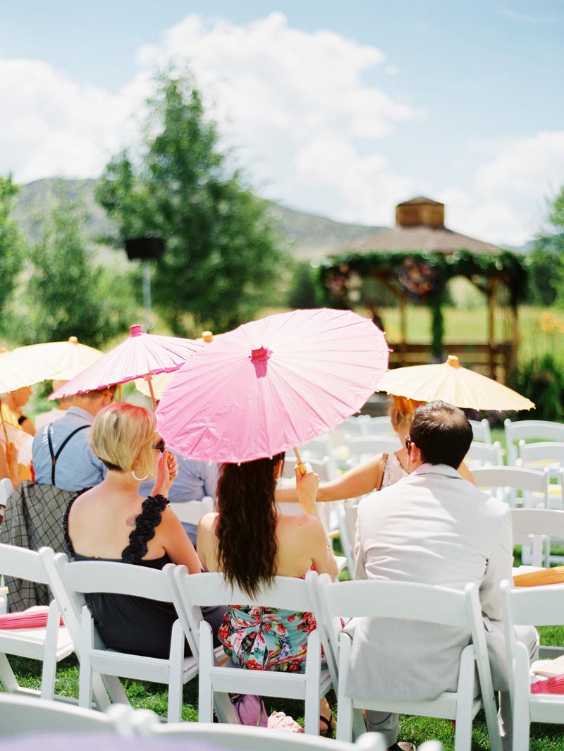 Fuchsia and orange paper parasols add so much depth to a ceremony. Find them at www.weatherornotaccessories.com | Kelli Lyn Photography | First Look Events