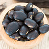 Close up of a bowl of the herb mucuna pruriens.