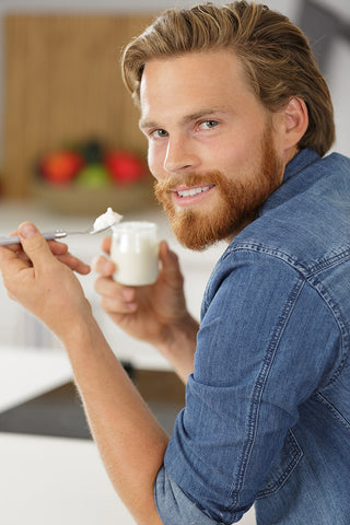 Man eating probiotic yogurt