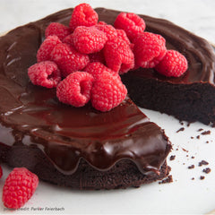 Flourless Chocolate Cake topped with raspberries