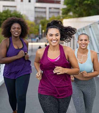 3 women jog happily