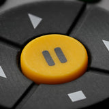 close up of the PAUSE button on a TV remote