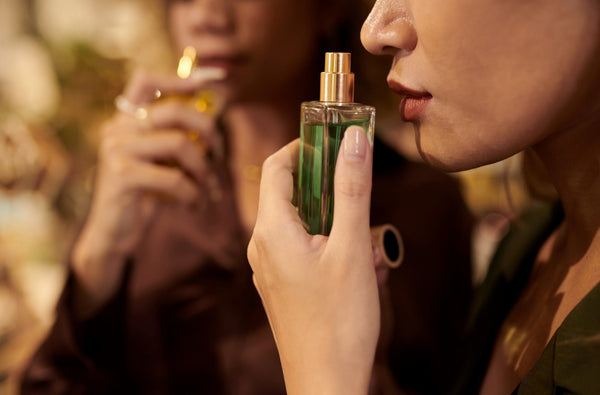 Women smelling a perfume