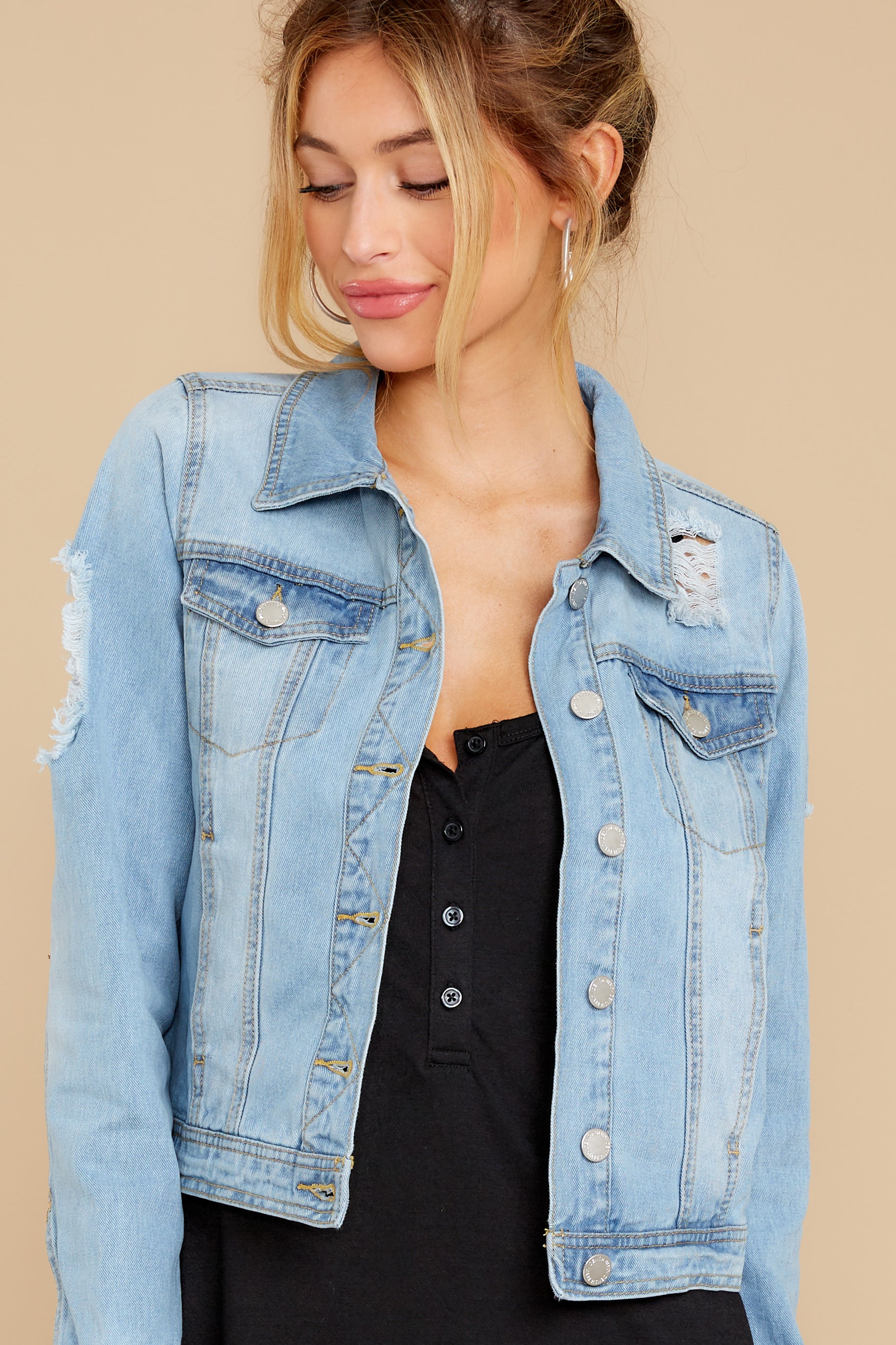 light wash distressed denim jacket