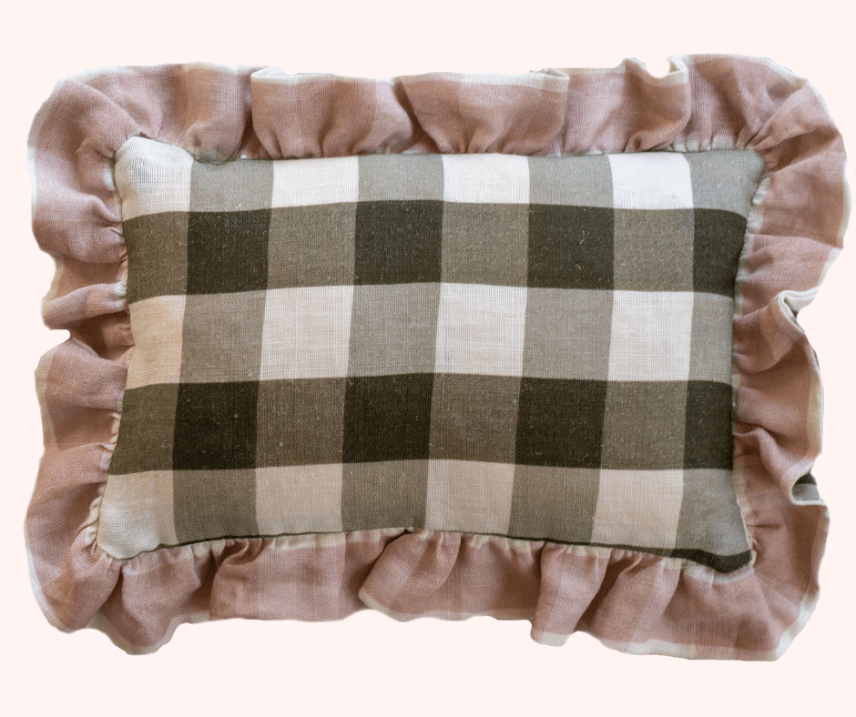 A plush cushion in large grey gingham with a velvet pink trim by Lisa Mehydene, founder of edit58. Image for her interview with La Basketry