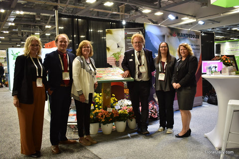 Plantpeddler team gathered around their commissioned handmade table