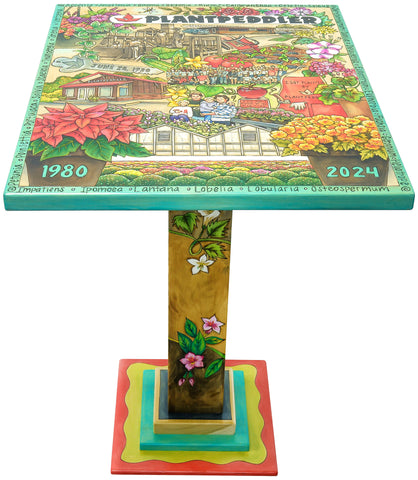 Final product - bar height table for Plantpeddler. Features annual flowers and imagery of green houses, family and team
