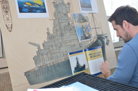 Artist painting USS Iowa Battleship