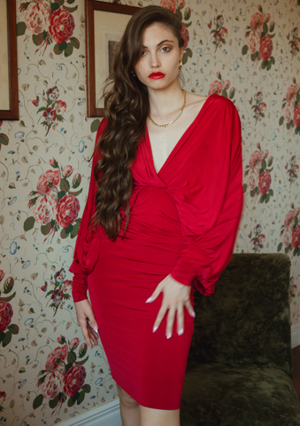 Model wearing our Deep Plunge Batwing Bodycon Midi Dress Lea in Red