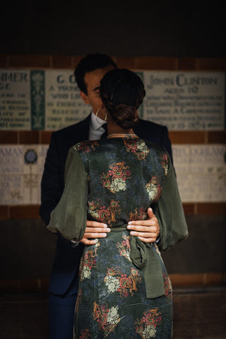 Jason holds Sia on the waist, a back view of our Ethically sourced Wrap Tie waist dress Verdant 