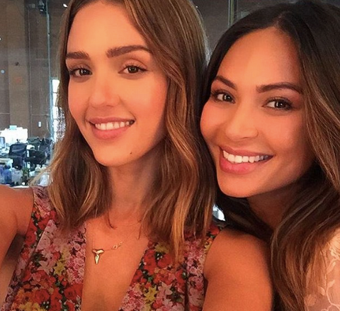 Jessica Alba wearing a gold shark tooth necklace. 