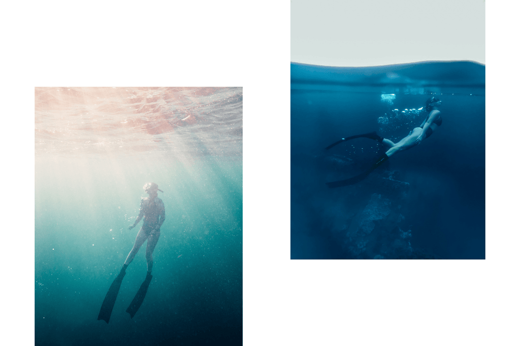 Freediving in the ocean wearing fins, mask and snorkel. Practicing to hold their breath while surrounded by beautiful coral reefs and ocean. 