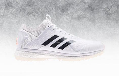 white adidas turf shoes