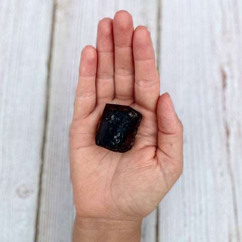 Black tourmaline in hand 