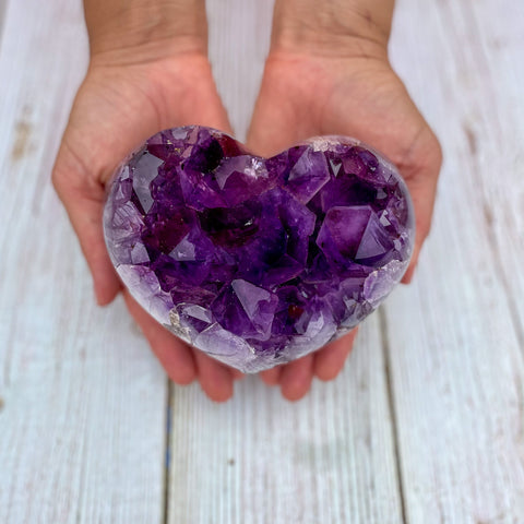 Amethyst heart in hands