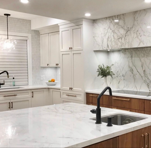 Kitchen lighting design with recessed lights and pendants. 
