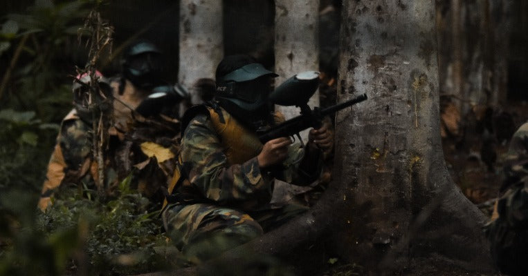 paintball players in the woods