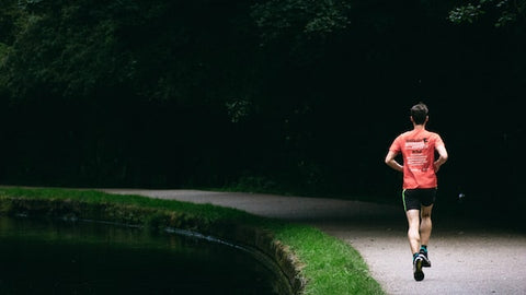 Male runner on empty road