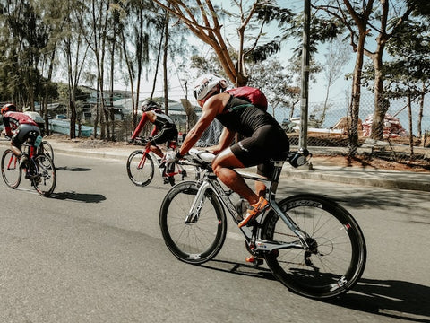 Big racers on road with trees in the background