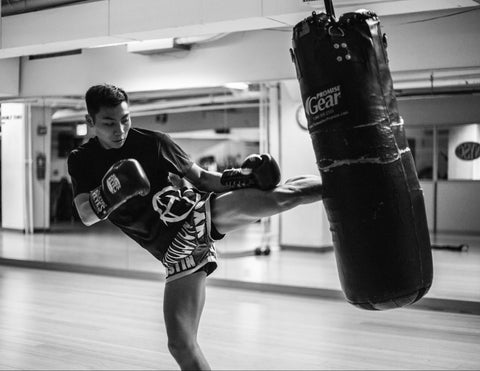  A man kicking a bag