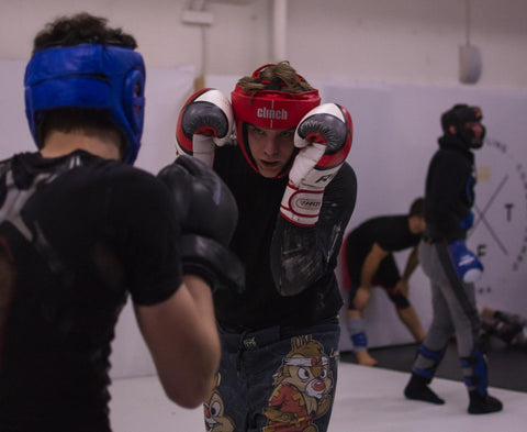 A boxer training his defensive skills to prevent boxing injuries