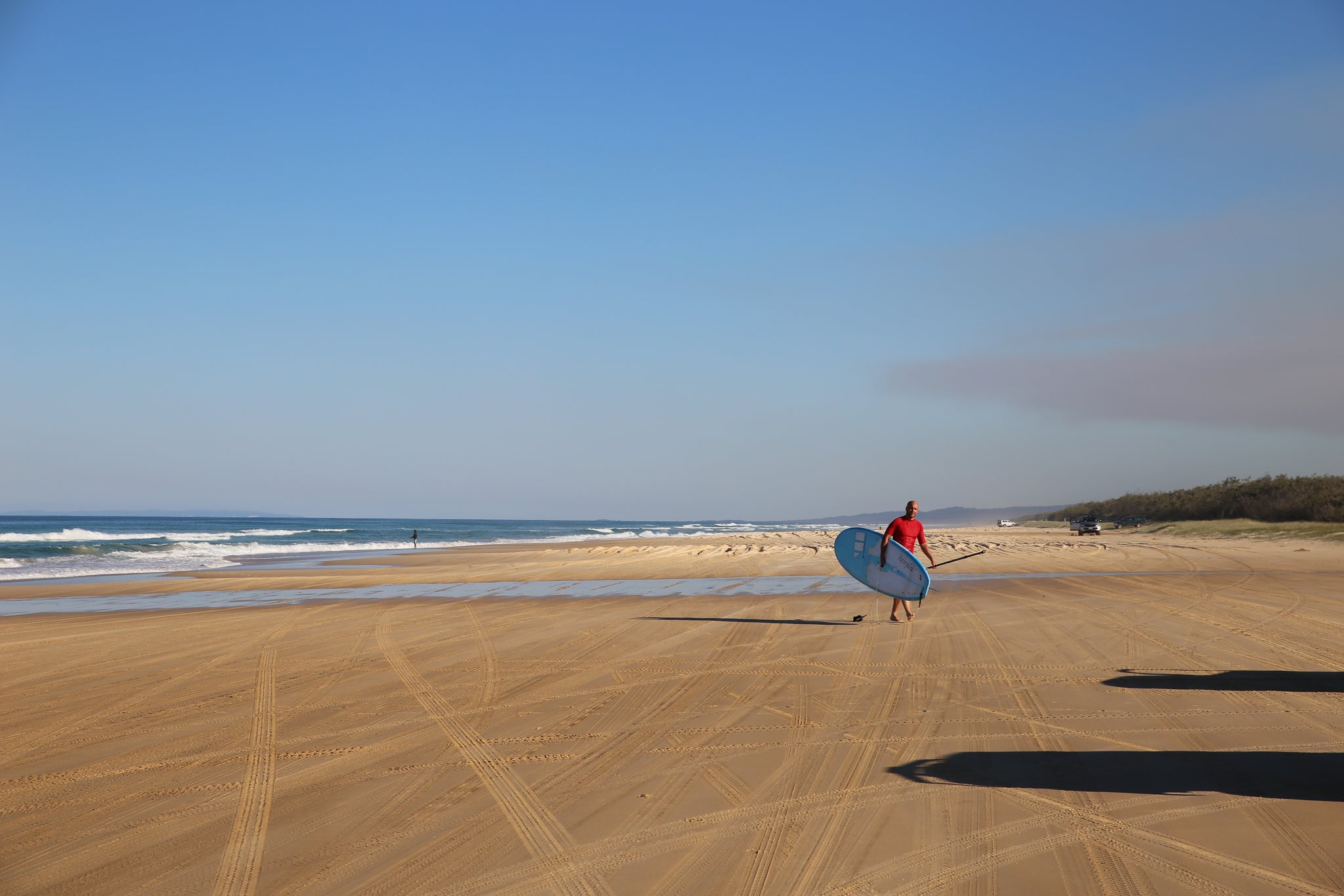 Fraser island sand up paddle boarding on long white beach