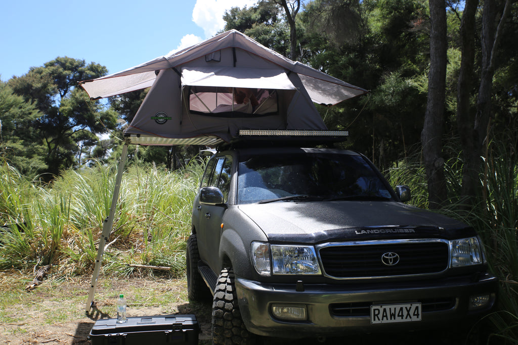 Mudstuck roof top tent with LC100 series