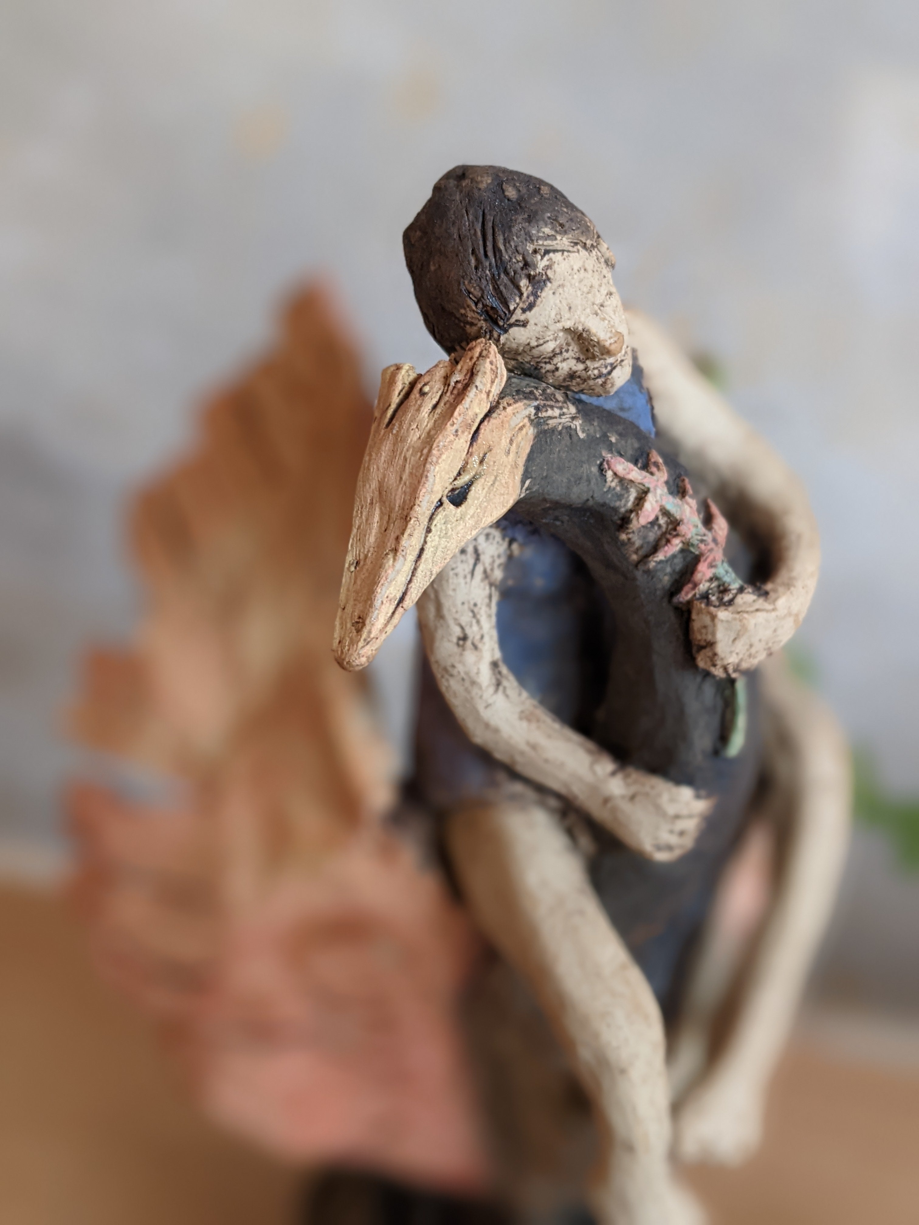 Mandy Dessent  ceramic sculpture, woman rising serenely on the back of a phoenix