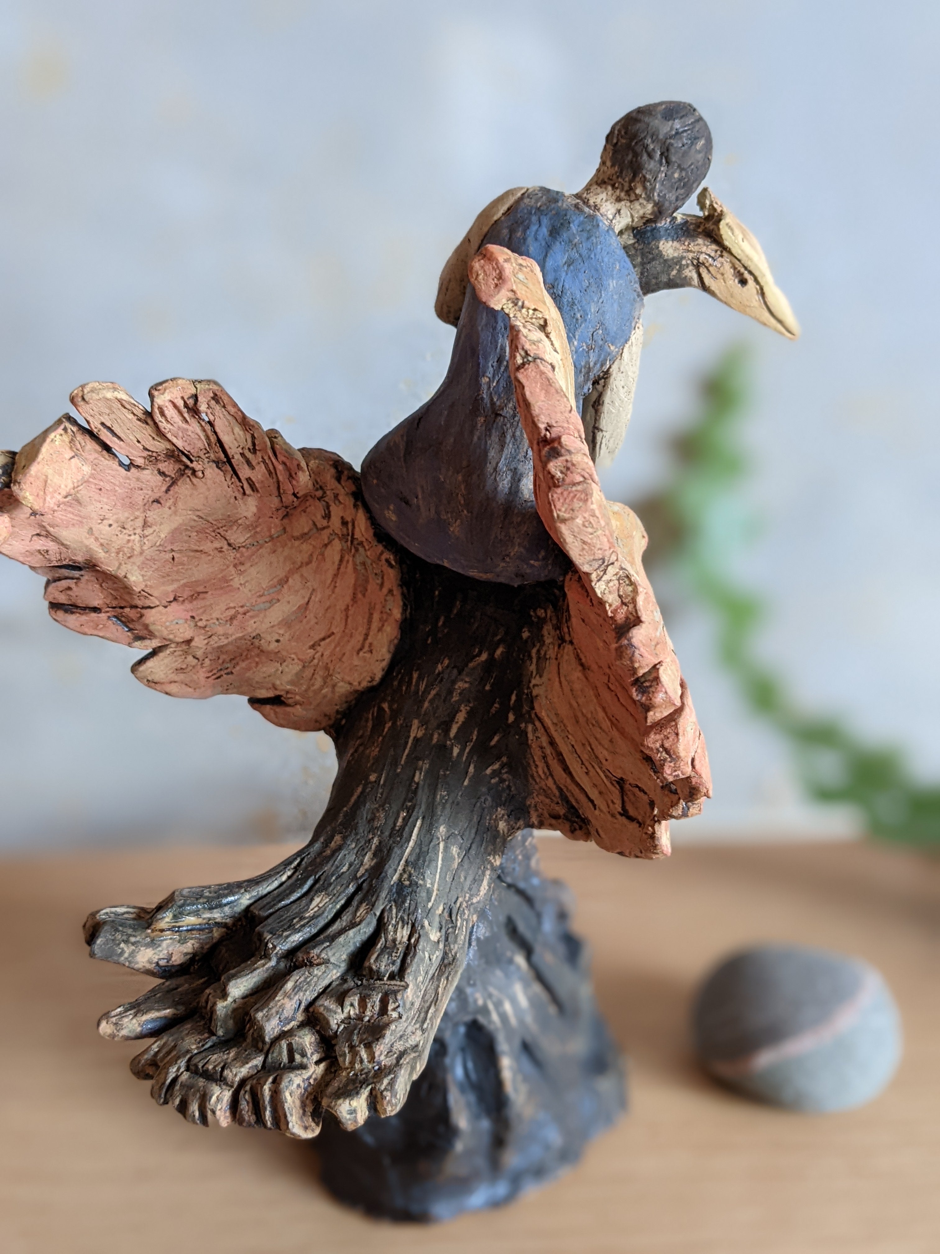 Mandy Dessent  ceramic sculpture, woman rising serenely on the back of a phoenix