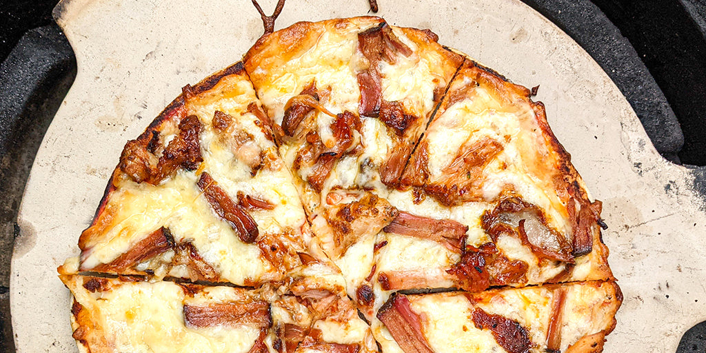 BBQ pork Lo-Dough pizza on a pizza stone