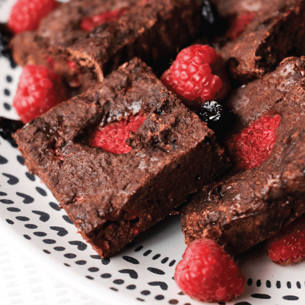 Lo-Dough cherry and raspberry brownies on a decorative white plate