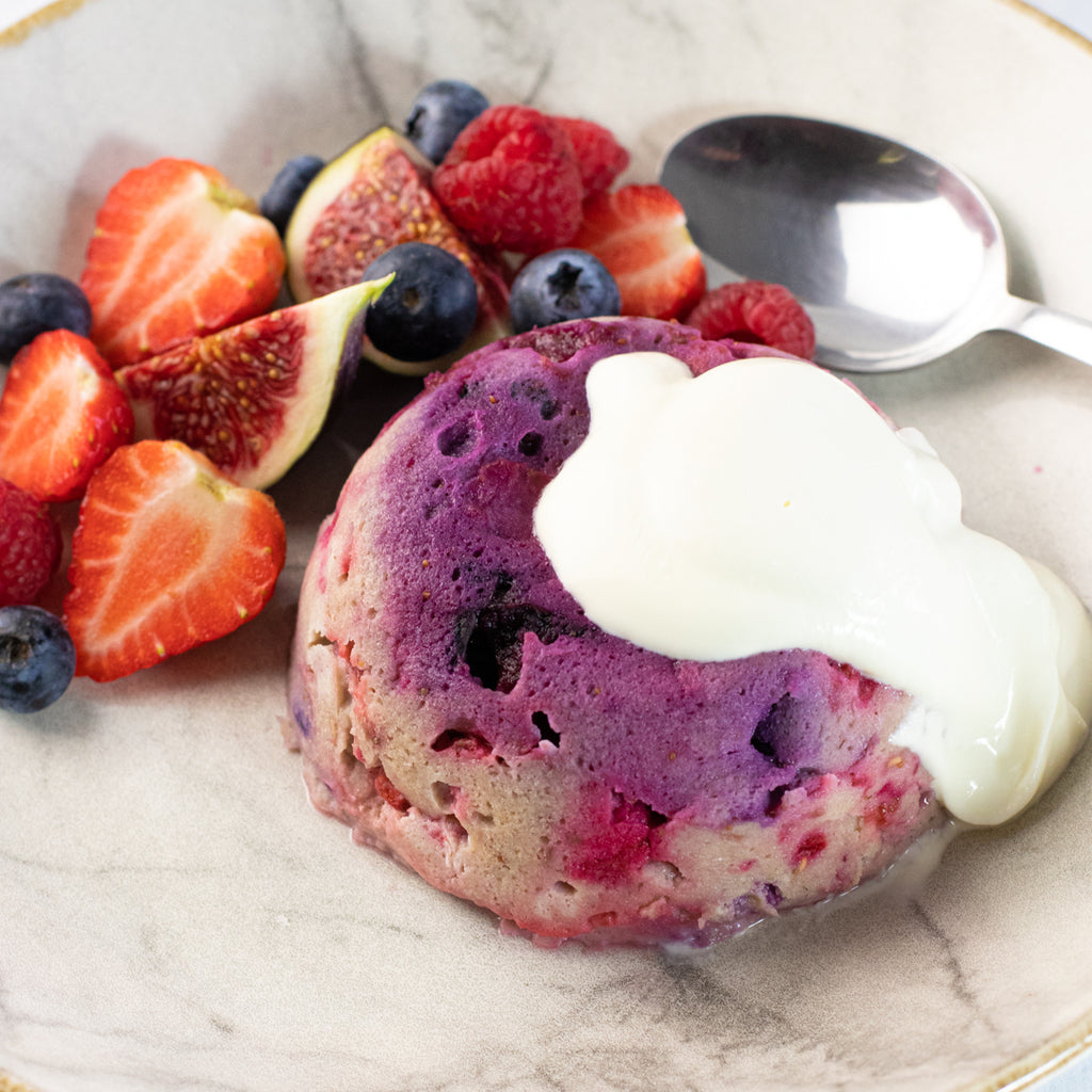 Mixed berry mug cake with fruit