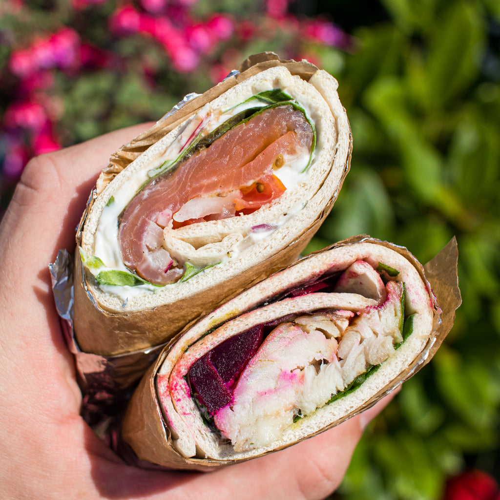 Salmon and mackerel wraps in hand