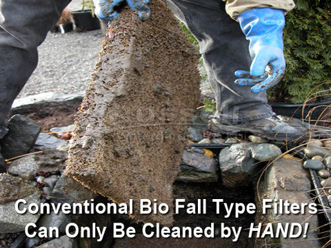 Hand removing a soiled filter pad from an annually cleaned pond filter