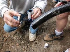 How to build a pond - put purple primer and and Red Hot pvc glue on the end of the flex pvc drain pipe