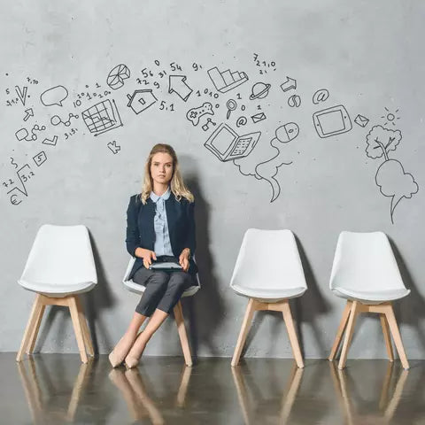 woman seated waiting for her assessment