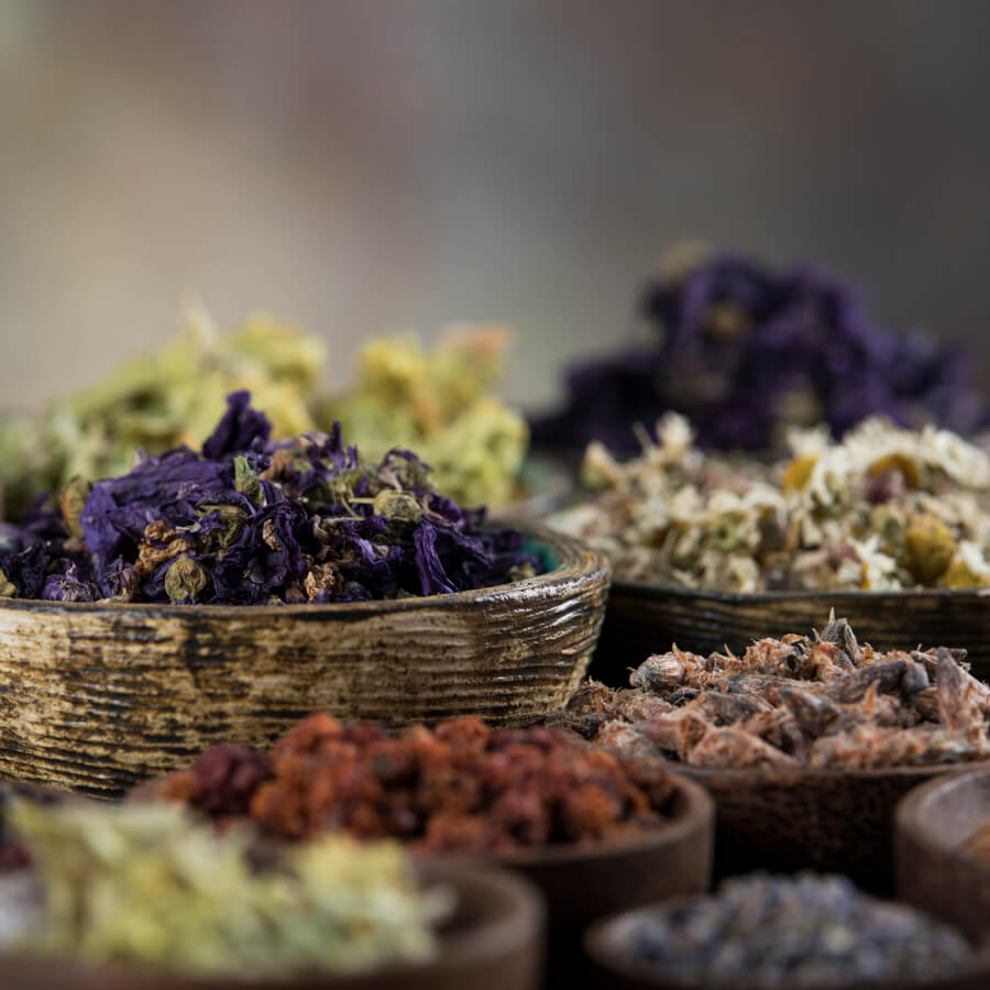 herbal supplements with some loose herbs on a tray