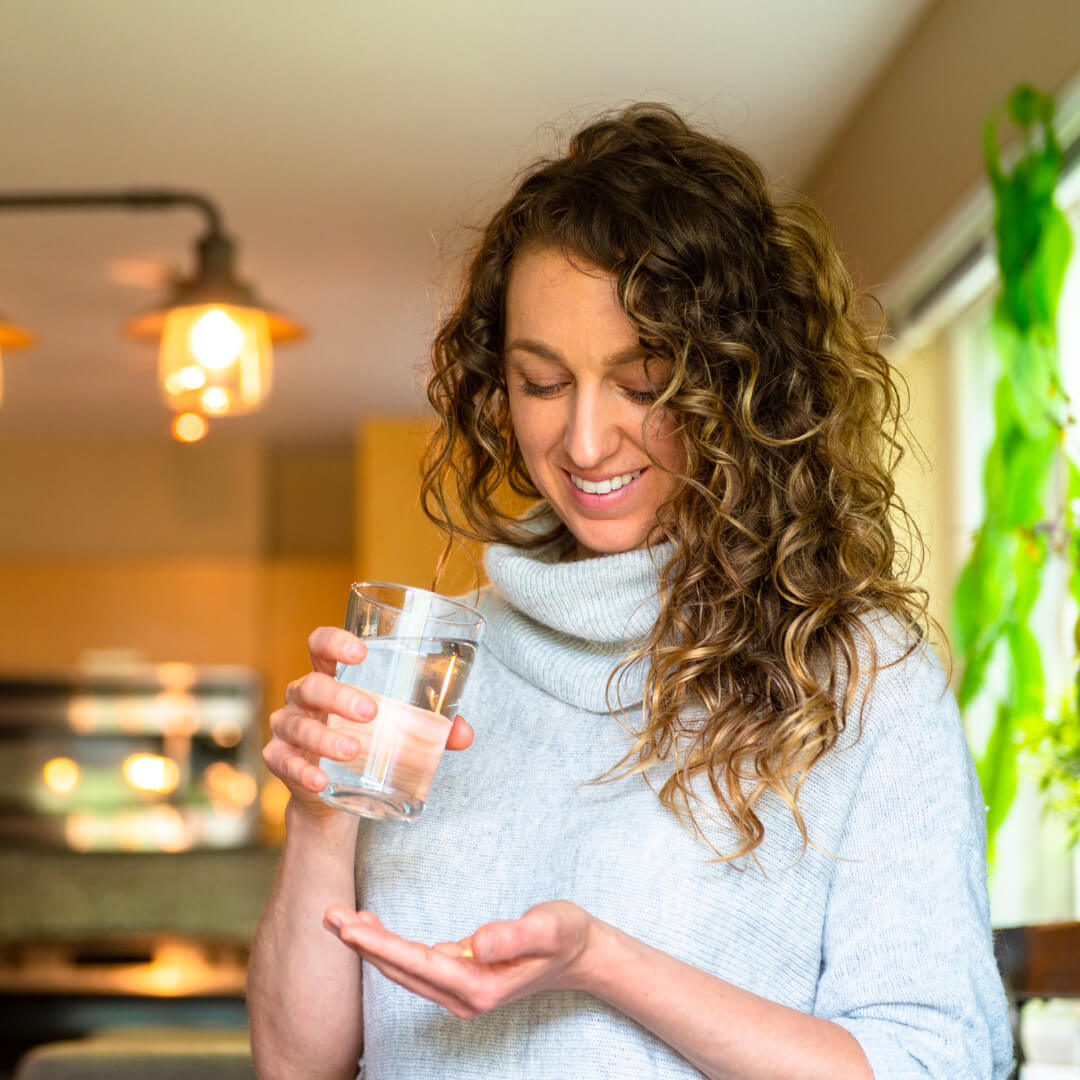 woman treating adhd by taking supplements